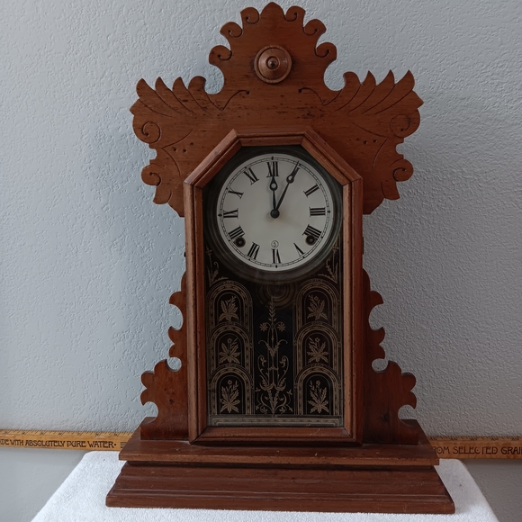 Vintage Wooden Wall Clock with Intricate Design